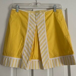 Lily Pulitzer sunshine yellow w/ yellow & white striped skort w/ pleat in front.